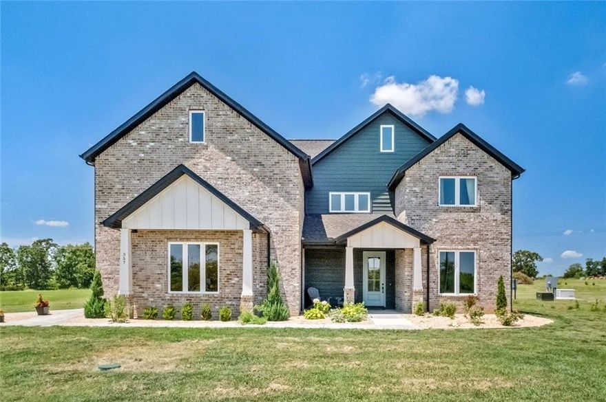 "Discover a practically brand-new home, nestled on over an 3 and half acres of land, offering a serene and spacious environment. This impressive property features five bedrooms, 3.5 bathrooms, a gourmet kitchen with double ovens and two dishwashers for effortless entertaining. With a Butler's pantry, formal dining area, and cozy eat-in kitchen, every corner exudes charm and functionality. The main level houses a luxurious primary bedroom and an oversized office or bonus room, while upstairs, you'll find four more bedrooms, two full baths, a versatile bonus room, and a delightful balcony for relaxation. Embrace the opportunity to make this stunning home yours and enjoy the luxury of space and comfort. Tornado shelter above ground in garage. Home has 440 amp on site idea to build a shop. Located 3 miles from XNA airport. New bypass coming that will have direct access to I-49! There is an option to buy the home and 1.05 acre for 825000