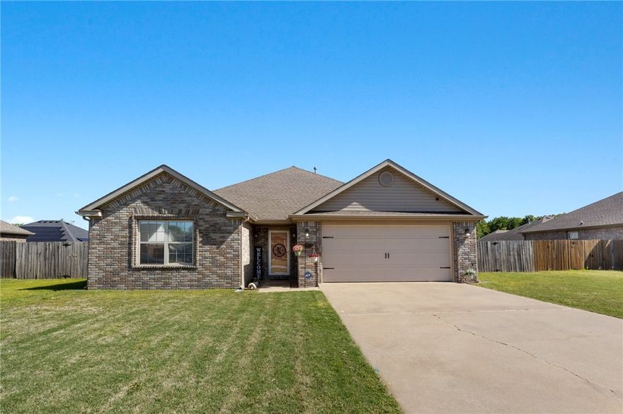 This home is sure to go quickly! Take advantage of this inviting and comfortable 3-bedroom, 2-bath residence. The generous living room with vaulted ceilings and a fire place offer a bright and welcoming environment. The kitchen features a casual dining space and sleek granite countertops. This house has 2 large walk in closets. One in the primary and one in the guest bedroom! Located in a quiet, peaceful neighborhood with wonderful neighbors, this home also offers quick access to the interstate. Plus, the University of Arkansas is just 7 miles away! Washer, dryer, and fridge to convey with accepted offer.