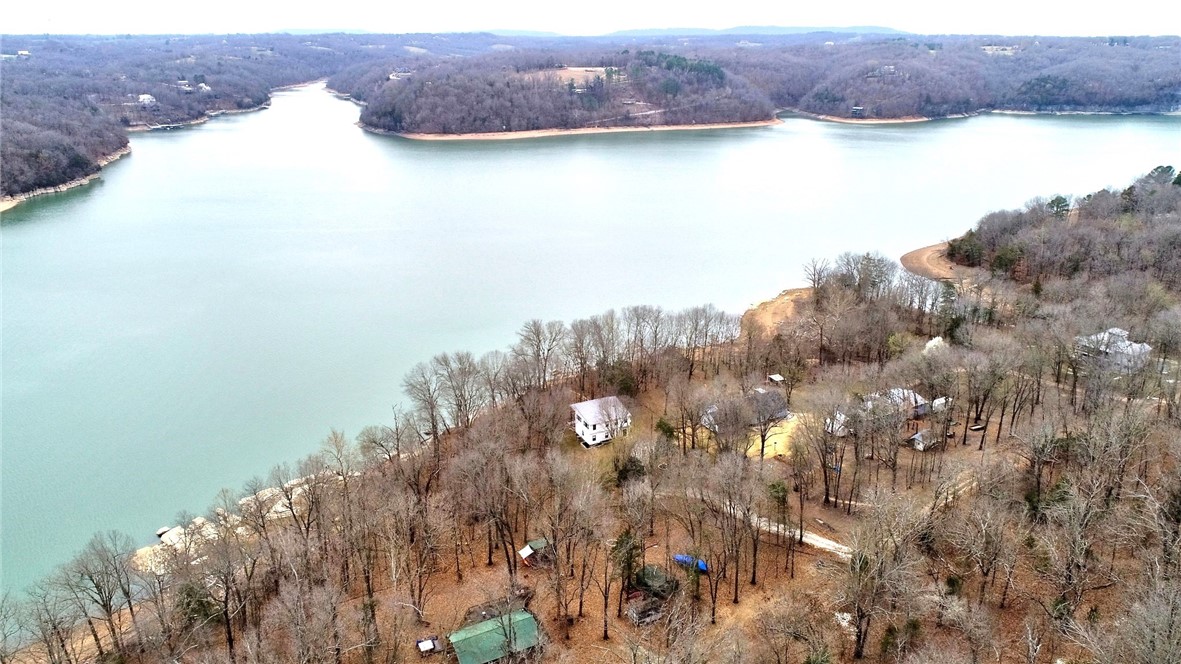 Modern lakefront home with incredible views of beaver lake!! This gorgeous home sits on 1.03 acres and offers true lakefront living. Tastefully designed with modern finishes and floor to ceiling windows, truly capturing the lake views from almost anywhere in the home. Three bedrooms, two full bathrooms, open living and kitchen space, incredible master suite with private deck and great bonus space on second level. Private well with filtration and softener system. Very well maintained and move in ready!