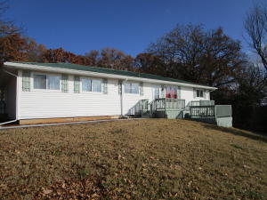 PRIVATE country living within a couple miles from Bull Shoals Lake. Enjoy this completely refurbished and updated home including: new kitchen cabinets, countertops, sink faucet, flooring, lighting, doors, decks, paint, bath fixtures, windows, & home warranty included. See Documents for a complete list of upgrades.