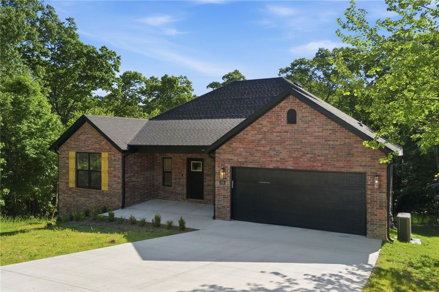 Brand new 4BR/2BA home with 1,900 s.f. at the end of a quiet cul-de-sac in the Bentonville School District. Enjoy wooded views from the back porch, open layout, gas fireplace, hot water recirculation system, city sewer, and insulated 2-car garage with insulated door. Close to Bella Vista amenities including lake access, pools, rec centers, and biking/walking trails. Perfect blend of privacy, comfort, and outdoor living!