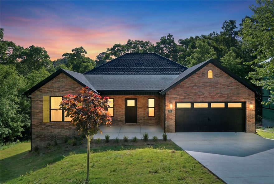 Brand new 4BR/2BA home with 1,900 s.f. at the end of a quiet cul-de-sac in the Bentonville School District. Enjoy wooded views from the back porch, open layout, gas fireplace, hot water recirculation system, city sewer, and insulated 2-car garage with insulated door. Close to Bella Vista amenities including lake access, pools, rec centers, and biking/walking trails. Perfect blend of privacy, comfort, and outdoor living!