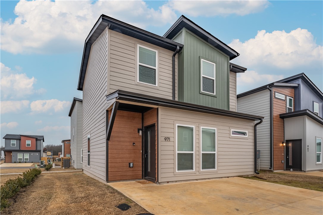 This modern 3 bed 2 bath home offers an open living area with plenty of natural light throughout. Currently an active Airbnb, showings will need to work around the bookings. Washer, dryer and fridge convey. $1,500 lender credit or 1% rate buydown for the first 12 months and free refinance with preferred lender. Furniture can convey at an additional cost. This would make the perfect starter home or investment property. Walking trails throughout the neighborhood, dog park, pickleball court, volleyball court, ample green space and lawn maintenance included. Less than 5 miles from Walmart Corporate office, Bentonville school district, close to restaurants, shopping, city parks, and schools.