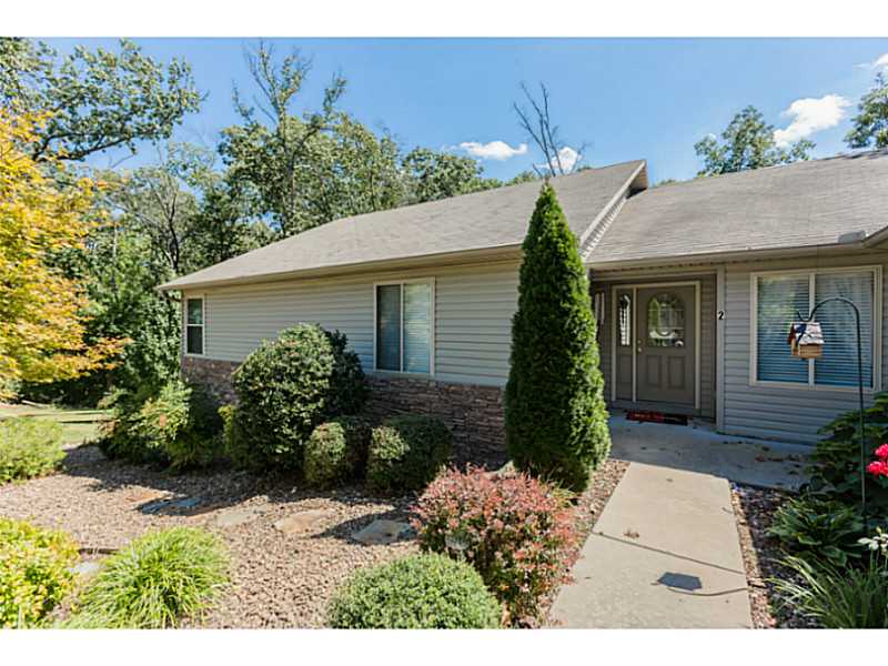 Looking for a lovely home on two lots? Main level family room with two sided gas log fireplace, plus 19' living room! Master suites on main level and lower level (separate entrance also). Newer HVAC (3 yrs), split bedroom plan; laundry room with sink; large pantry in kitchen; 11 x 27' workshop not included in sqft,. 11 x 27' workshop not included in sqft and could be kitchenette on lower level. Office w/built ins