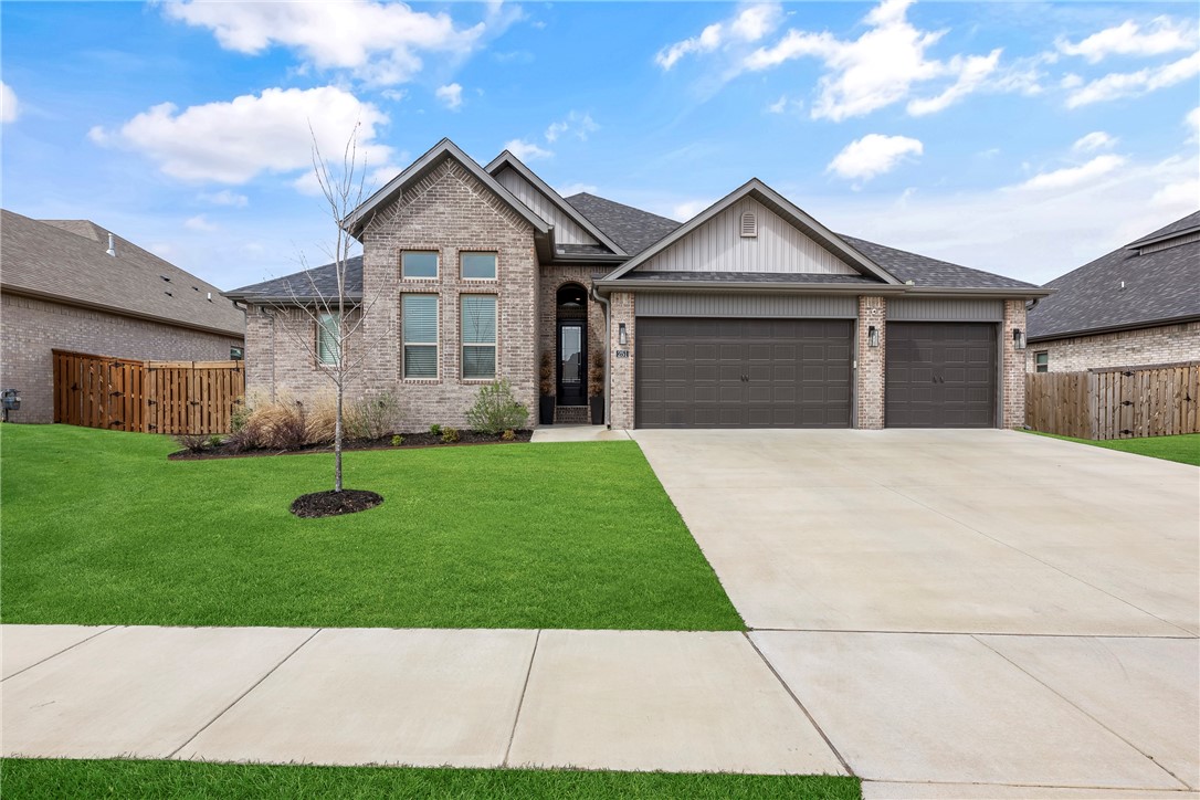 This Gorgeous brick home features 4 bedrooms and 2.5 baths with a split floor plan allowing for privacy and open-concept living with a practical and spacious layout. Enjoy the spacious Kitchen with custom cabinets, granite countertops, gas cooktop and convection oven. The dining room features large windows, bringing in plenty of natural light and giving that spacious feeling. The beautiful wood floors brings a warm and comfortable feeling to this home. Stay cozy in the winter by the fireplace in the living room and entertain your guests in the spring and fall by the Fireplace under the covered patio.
The large primary suite includes a whirlpool tub providing a relaxing escape. This home combines comfort and functionality making it perfect for your family.