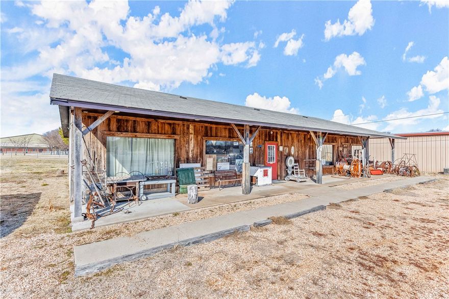 Ideal Commercial property for your business with 145' +/- on busy Hwy 71B in Lowell.  Updated in 2015 with HVAC System, New roof in 2024.  Added water, restroom, and septic system in 2024.  2,800 Sq Ft of heated/cooled space currently operating as an antique retail outlet.  Has 12+ parking spaces in front of building with ample space on the .5 Acre lot to add more.  Facility features 9' ceilings over open floor, a roll up garage door on side for easy loading and unloading of freight/merchandise.  Perfect for expanding your business out of the garage/home office, or establishing that business you have been just waiting for the right location to become available.