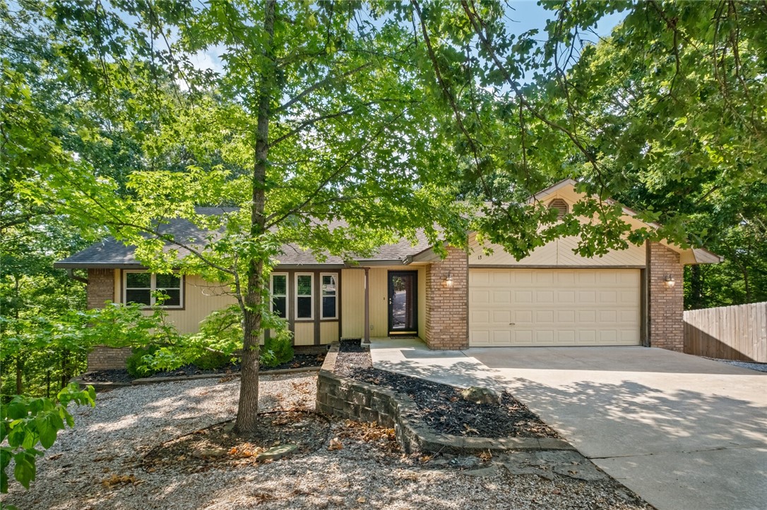 Charming 3-bedroom, 2-bath Bella Vista home with endless potential! This well-maintained property features a separate dining room, an eat-in kitchen, and a freshly re-stained deck. Nestled on a private lot with wooded views and no homes directly behind, it offers a peaceful, secluded setting. Located a quarter of a mile walk to Lake Avalon and the Tunnel Vision mountain bike trail sits at the top of the street, the home provides easy access to recreation while maintaining a quiet retreat. Solid construction and plenty of room to update or personalize, make this a must-see.