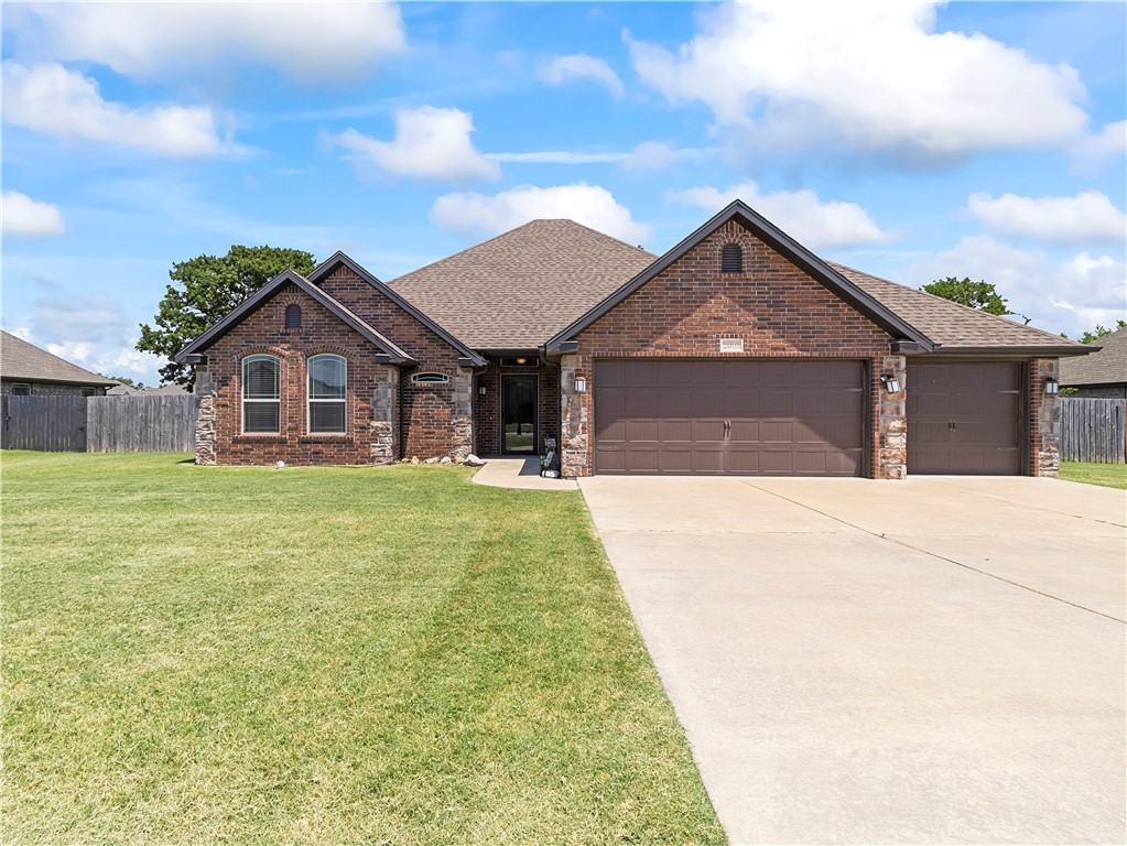 Looking for the perfect location, a huge backyard, and a 3 car garage? Well this beautiful one level, split floor plan home has just that! Inside the home you will find it freshly painted throughout, and brand new carpet in each bedroom. The main living space has gorgeous engineered hardwood floors, with tile in the wet areas. You will enjoy the large eat-in kitchen, which has a wonderful working island space, a built-in desk area, and a generous size pantry. All bedrooms are spacious with walk-in closets. Outside you will enjoy your oversized yard (0.32 acres) that is fully fenced for your privacy. If you love to entertain guests you can under the large sized covered patio, with a gas hookup for your grill and electricity for your TV. This home sits on a very private cul-de-sac street. And is close to the Razorback Greenway bike and walking trails, shopping, and restaurants. It's a must See!