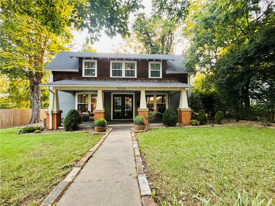 Enjoy easy access to everything from this lovely, centrally located home! This historic home was previously renovated from top to bottom and has a dreamy front porch, spacious backyard, and beautiful interior design. Walking distance to the University of Arkansas, downtown Fayetteville, the Mill District, the Ramble, and many restaurants and breweries. There are unique built-ins throughout, a cozy fireplace, and plenty of charm. The brick patio in the backyard is a perfect location for a fire pit, grill, and outdoor seating. This is a rare opportunity to be located on a quiet, shady street, with a large yard and space to relax, yet still right in the heart of it all. One block from the newly expanded public library and a short walk to the Farmer’s Market and Razorback Greenway. This historic charmer has it all!