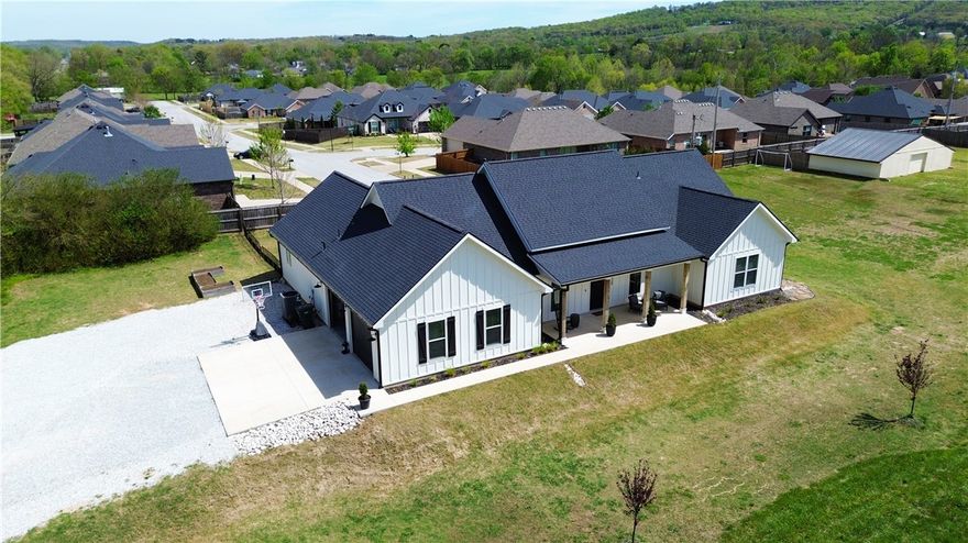 Built in 2023 and sitting on 2.49 peaceful acres, this 4-bed, 2.5-bath custom home with a dedicated office is the kind of place that makes you forget the city exists — until you realize you're a 4-iron from Stonebridge Meadows Golf Course.
Inside, you'll find polished concrete floors, quartz counters, high-end appliances, a farmhouse sink, and a butler's pantry that earns its keep. The split floor plan gives everyone breathing room. The primary suite features a soaker tub, tiled shower, and a laundry room that connects directly to the closet — because that's just smart design.
The oversized 2-car garage is insulated with epoxy floors, the attic is pre-engineered for a future second story, and a Nest thermostat keeps things dialed in. Out front, a big covered porch. Out back, a covered patio with a TV and hot tub ready to go.
County quiet. Modern everything. Room to grow.