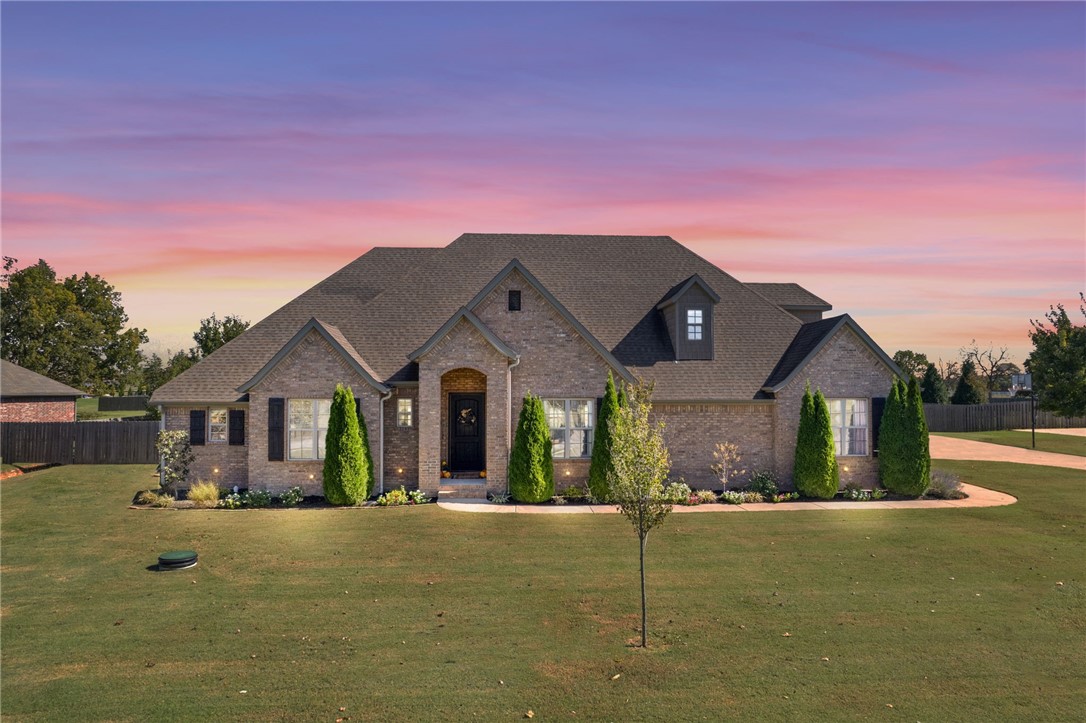 Welcome to 813 Lancelot Dr in beautiful Elm Springs right in the heart of Northwest Arkansas! Enjoy the feel of country living while still being close to schools, shopping, restaurants & entertainment. Just 7 minutes off the I-49 corridor, you can get anywhere you want to go in good time. Less than 15 minutes to the Pinnacle Hills area & less than 20 minutes to either Bentonville or Fayetteville. This home went through a complete interior renovation in Fall 2023 with too many updates & upgrades to mention that you just have to see! The kitchen is a chef's dream with professional grade appliances including a double oven, commercial grade vent hood, upgraded leathered quartzite countertops, 14' island with waterfall edge, cabinets to ceiling & large dining area. Enjoy hosting friends & family in the large living room. Watch the morning sunrise on the back patio overlooking your over 1 acre yard then enjoy the completely shaded yard in the evenings! Neighborhood connects to 120 acre Shaw Family Park!