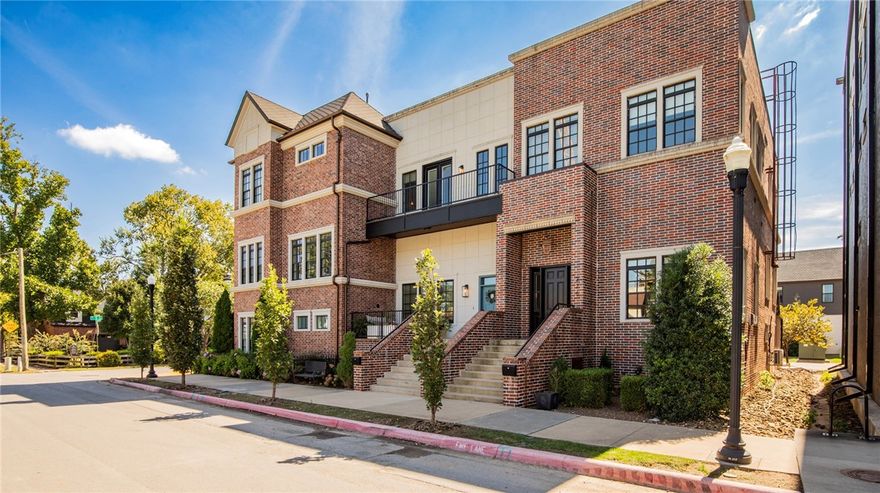 Here’s your opportunity to own a stunning townhouse just steps from the Downtown Square! Walk to fine dining, coffee, Farmer’s Market, events, and entertainment. Dave Peel Park, just across the street, is being transformed into an amphitheater—imagine enjoying live music from your own front porch! Behind the home is a shared greenspace, perfect for pets or picnics. This stellar location is one of the most desired in the area. Inside, soaring 18' ceilings and abundant windows fill the home with natural light, creating inviting, elegant spaces. Multiple outdoor living areas add to the charm. Parking is no problem with a 2-car attached garage plus space for 2 more in the driveway—a rare find for downtown living. This isn’t just an elevated home, it’s a lifestyle you’ll love!