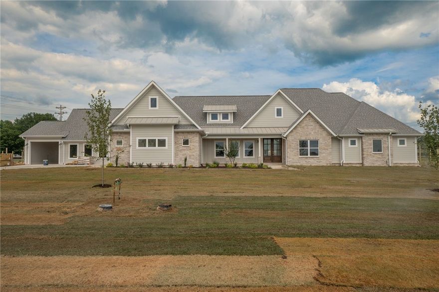 Pending before print. Gorgeous new home located just outside of Farmington. Home features beautiful finishes and tons of storage. Kitchen features custom built cabinets and quartz countertops. Luxury vinyl plank throughout with herringbone tile flooring in primary bath. Contains Mother-in-law suite with 1 BR/1 BA, kitchenette with DW, microwave, sink and beverage fridge plus a 1-car garage.  Agent owned.