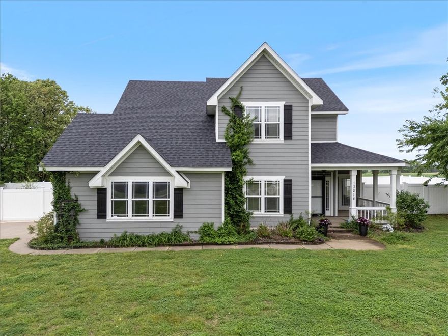 Charming farmhouse-style home on a full 1-acre lot with incredible curb appeal! The stunning mature tree in the front yard creates a welcoming first impression. This 4-bedroom home offers two spacious living areas on the main level, with all bedrooms— including the primary suite—located upstairs for added privacy. Brand new carpet throughout!
Enjoy both a front porch and back porch, perfect for relaxing or entertaining. A versatile 20x40 shop adds even more value, complete with a 10x10 office space and mini split—ideal for hobbies, storage, or working from home. New roof installed March 2026. A rare combination of character, space, and functionality!