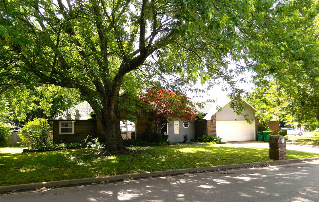 What a great home in a lovely established neighborhood with easy access, mature trees, and manicured lawns. Freshly painted throughout, this home is all brick with full house guttering, fenced back yard. Light and bright with dramatic 10 ft. ceiling, crown molding, huge kitchen with tons of storage, large utility room/pantry with sink. Three good sized bedrooms, large main bedroom with two separate closets. Two bathrooms, one with whirlpool tub and two vanities in the main bath, second bath shared by two bedrooms and a third guest bath. Within walking distance of schools, shopping, restaurants. Manufactured hardwoods throughout main areas and ceramic tile in wet areas. Beautiful lot with landscaping, mature trees, fenced in back yard and patio area.