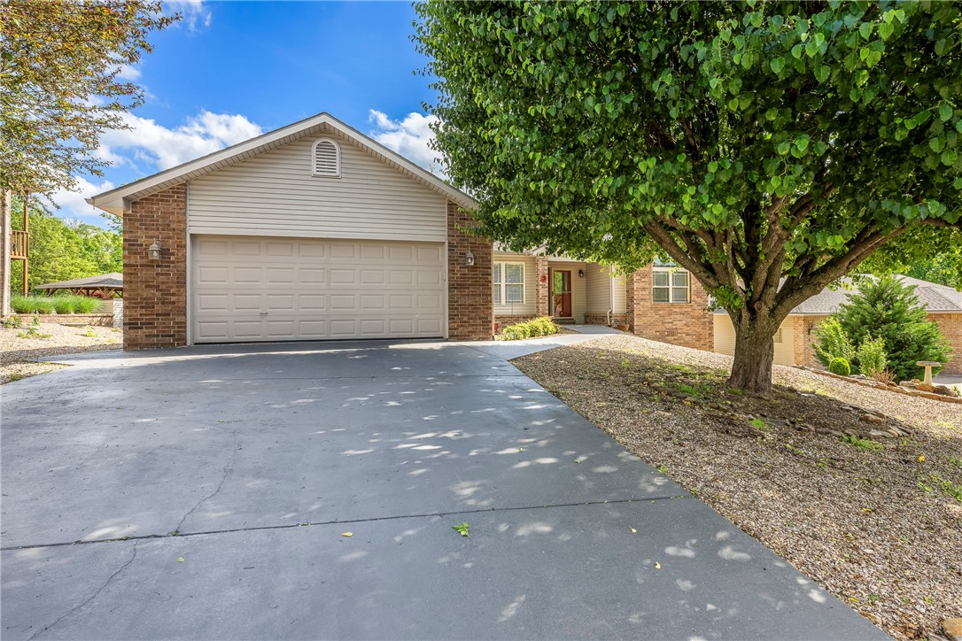 New: (2024) Luxury Plank Vinyl & fireplace remote, (2024) New Carpet in bedrooms, (2023) Heat Pump, (2019) Roof, (2018) Kitchen appliances, (2015) 200 Amp panel for downstairs rooms & hot water heater. 463 feet heated & cooled workshop / bonus room downstairs not included in home square footage. Built in 1999, this home features; 3 Bedrooms, 2 Bathrooms, Sunroom, Formal Dining, 2100 square feet, split floor plan, 2 car garage w/ attic storage & workshop area, spacious living room w/ gas log fireplace & vaulted ceiling, eat-in kitchen w/ lots of cabinets for storage, pantry, utility room, deck, mature / professional / low maintenance landscaping. Spacious master suite with walk in closet. Home to be hooked up to sewer. Easy access to I49 for easy daily commute. Close to Scotsdale Golf Course, Loch Lomond Recreation Complex, Branchwood Recreation complex.