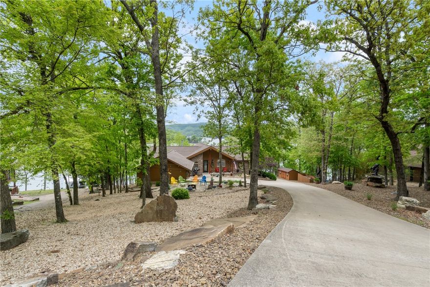 A Treasure on the crystal clear waters of the North End of Beaver Lake!  Private Boat Dock with 2 - 10 x 30 slips, 2 storage lockers, 1 pontoon boat lift, 2 jet bike lifts, full length partially covered swim deck, & solar electricity.  Excellent access to dock via gentle sloping walk or cart ride on paved access to low Corps of Engineers "take line". Exquisite, Meticulously Maintained Custom Home with open floor plan & vaulted ceilings, panoramic lake views & surrounding natural environment through expansive windows. Chef's Kitchen with Elegant Cabinetry, Premium Appliances & impressive Butler's Pantry. Upper & Lower Oversized 2 Car Garages, totaling 4 Car Garages.  Relaxing Fire Pit Entertaining Area, Generac Generator, Water Filtration System, Flower Bed Sprinklers, Professional Unique Rock Landscaping, and too many more amenities to list! (See photo comments for more info).  Treat yourself to the Ultimate Lake Experience!