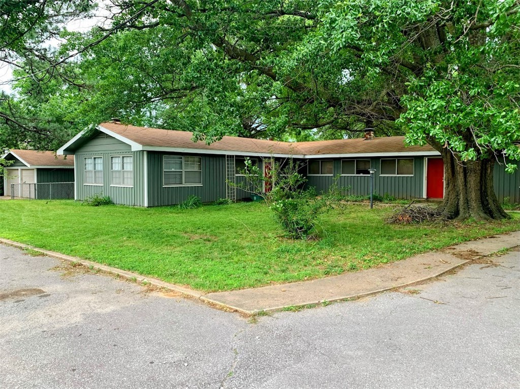 Rent Just Reduced!! Spacious and unique single family home in Fayetteville. 3 bedroom, 2 full bath - 2,120 SF. Large kitchen with built-in breakfast bar and lots of countertop space, cabinets and drawers galore. Appliances include full-size refrigerator, gas stove and dishwasher. Lovely dining area just off kitchen and large living room with fireplace. Bathrooms have shower/tub combos. Vinyl plank and ceramic tile throughout home. Great deck off back of house for summer entertaining. Large laundry room with washer/dryer. Two car garage.