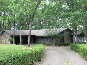 Great view and private lake access is yours at this beautiful property. Charming mid century home with sunken living room boasting vaulted ceilings and wood beams. Rock fireplace in the family room is nice and cozy. The spacious sun porch is perfect for entertaining and has views for days! The entry shows off a hand carved wood door and stone flooring. Check out this truly unique property nestled at the end of Lakeview Drive. The street name says it all!