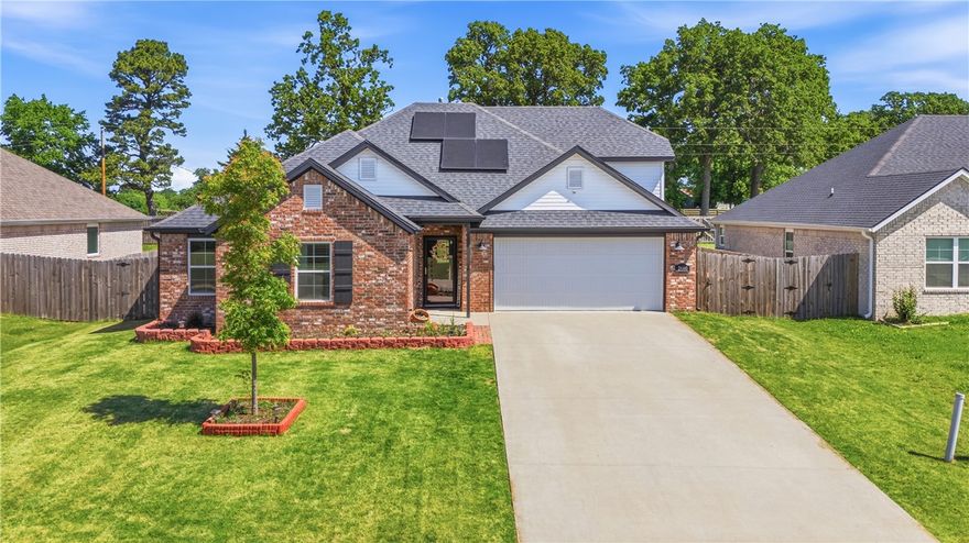 Your new home, complete with solar panels, is ready to soak up the sun with you this summer! You'll be hanging out with your guests in your fenced back yard while your solar panels are helping you save on utilities. You have to see this beautiful, full-brick 4 bedroom home, complete with a cozy gas fireplace, granite counters, a split flor plan, and plenty of storage! Cooking for a crew? You will love the stainless appliances, especially the gas range. There is an eat-in kitchen area as well as space for island bar stools. Upstairs you'll find a 4th bedroom or bonus room for an office. This one has everything you have been waiting for. Call today for a private tour!