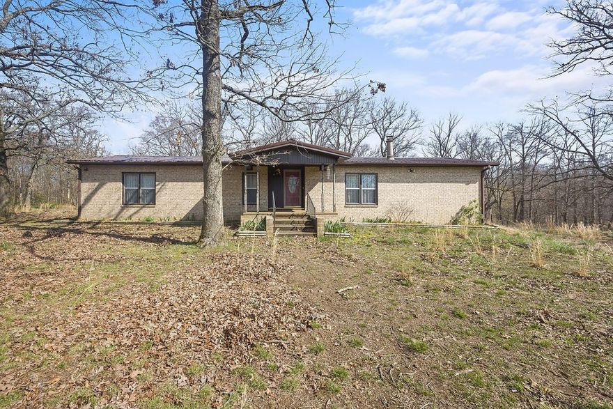 *Seller is offering $5,000 in concessions*
From a wet-weather creek to forested hills, this property is a nature-lover's paradise! Enjoy the peace and tranquility of country living with breathtaking views overlooking your own private valley, or use the land for agriculture, hunting, or other recreation! The home has a screened-in porch, which offers a front-row seat to all that nature has to offer! And inside the home, the cellar offers a perfect place to store your fruit, vegetables, and other food!
It's rare to come across a piece of land this large at this price in NorthWest Arkansas. Don't let this opportunity slip by!