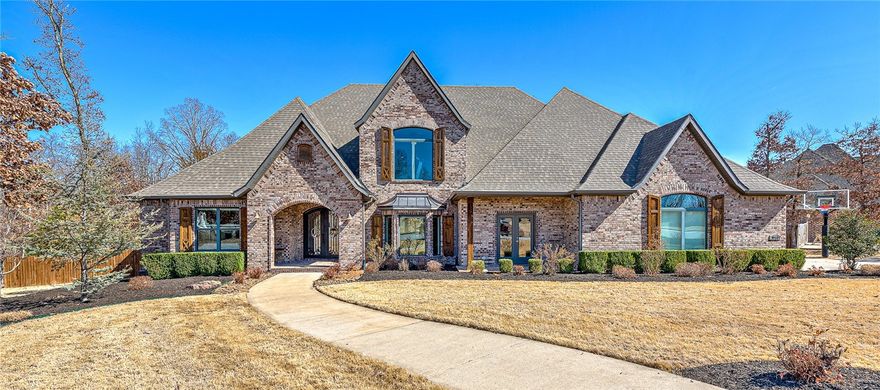 This stunning 5,396 square foot estate sits on a sprawling 1.42-acre lot. When you step inside you will discover a meticulously designed floor plan boasting 5 bedrooms and 4.5 baths. But the heart of this home is undoubtedly the chef's kitchen. Equipped with top-of-the-line appliances including a 6-burner Electrolux cooktop w/ pot filler, Electrolux professional refrigerator, Electrolux double ovens, a built-in ice maker, and Miele dishwasher, this kitchen is every chef's dream.
Entertainment knows no bounds with the upstairs presenting an array of captivating spaces including the highlight, a custom built golf simulation and media room, tucked away behind a secret door disguised as a bookshelf. All electronic equipment necessary for your virtual golfing adventures is included, ensuring immediate use for you and your guests.
The outdoors features a large heated gunite pool and a cozy firepit area. The back porch is a true retreat w/ a fireplace and built-in grill, creating the ultimate setting for entertaining.