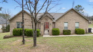 Discover the perfect blend of comfort and style in this beautiful 4-bedroom, 2-bathroom home, nestled on a generous 1.8-acre lot. Being a golf cart ride away from the Russellville Country Club is perfect for any Saturday with your buddies. This home is perfect for those seeking a peaceful retreat with close proximity to recreational and social activities. Don't miss the opportunity to make this exceptional property your own!
