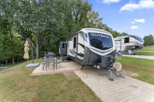Welcome to Cricket Creek RV Estates! Become the newest member to join this Table Rock Lakeside Gated RV community. Deeded RV lot setup with a 2020 Keystone Outback 32 ft bumper pull camper with 3 slides, fireplace, entertainment seating, sleeper sofa, large screen TV, center island, and double refrigerators. This camper comes completely furnished with 2 BBQ grills (gas & charcoal), patio furniture, even a scooter you can drive to the full service marina Cricket Creek Marina, Oh did I mention you can also purchase a 2015 Suncatcher G3 Tritoon boat w/150 HP Yamaha & boat lift, located in a slip at the marina for add'l money. The boat has very low hours and is on a lift. Call for more details on the possible boat purchase as a package deal.
