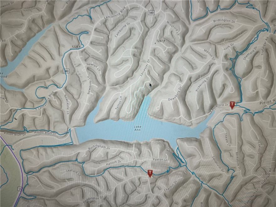 Perced Lot with Lake Views! Spring Fed Lake Ann, motorboat friendly! Bentonville Schools, on a paved road. 1 Mile from Flo Ride / Pinyon Creek Trailhead. Less than 2 miles from Kingsdale Golf Complex (9 and 18 Hole Courses). Lake Ann is a 112 acre lake and is one of 3 motor boat friendly lakes. Large lot with a perfect build table with Lake Views.