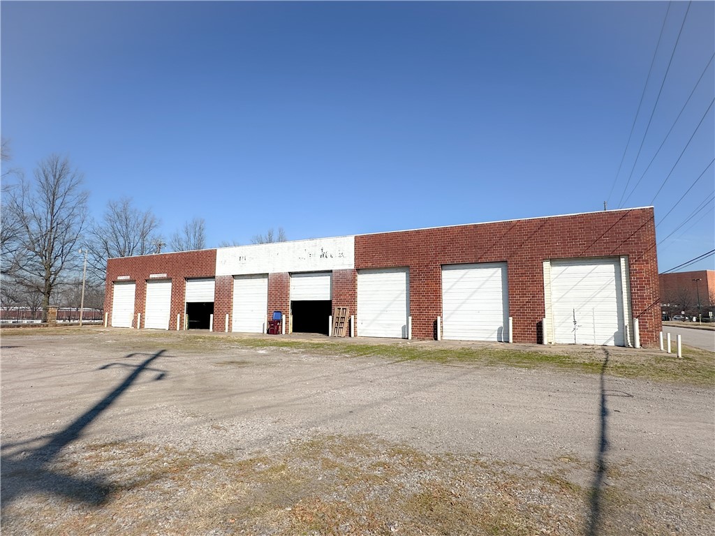 Large open warehouse space with 19' clear height and 13' to rafters. Eight (8) 14' grade level doors and one (1) 12' grade level door. Yard space and office space available. Located just off Wheeler Avenue (13,000 VPD) near downtown Fort Smith.