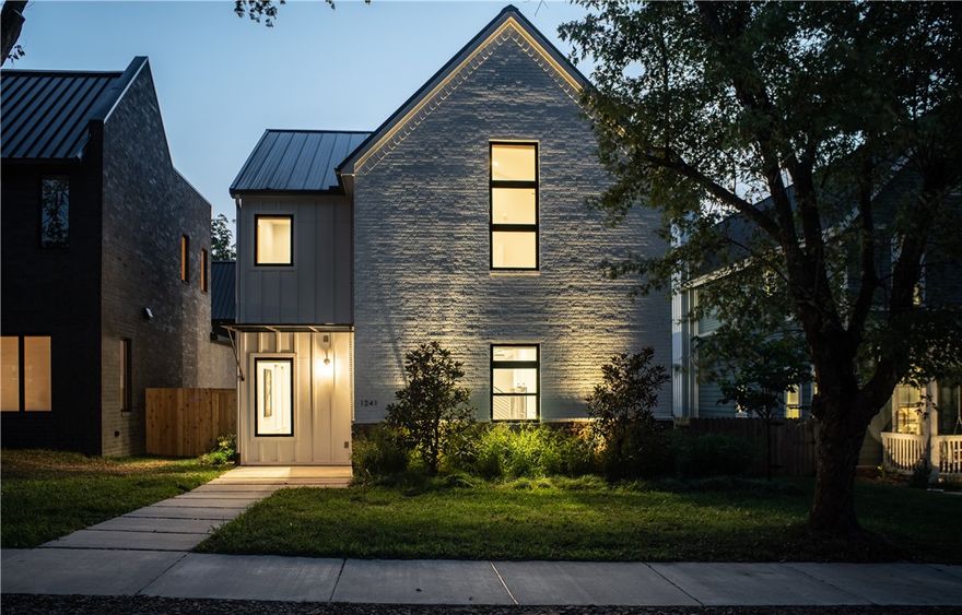 Modern, custom-built home located in the desirable "Top of Main" downtown Bentonville neighborhood. Crystal Bridges (and the new Crystal Bridges North Expansion) are just blocks from this house.  The Slaughterpen Trail System surrounds the house on three sides with a brand new trail currently under construction on the property behind the house.  5 bedrooms total with one bedroom (or bonus room) and bathroom on the main level. Gourmet kitchen with gas cooktop and double oven. Home office with built-in desk and bookshelf. Fenced yard with covered outdoor patio. Standing seam roof. House sits up on a hill with fantastic western views overlooking city park and mountain bike trails. Master suite with private balcony. Alley-loaded oversized garage. Neighborhood is a quiet loop located Northwest of the Crystal Bridges Museum and 1 mile north of the Bentonville Square. The house features several healthy, smart home, and energy efficiency updates including an ERV, fresh air ventilator, smart locks and more.