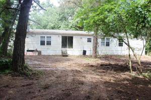 What a great private country setting with this 4 bedroom 2 bath 2003 doublewide on 4.12 acres m/l boasting a great open floor plan, huge master suite & wood burning fireplace in bonus room. All #'s are approx., age & sq. footage per assessor, buyer to verify utilities & existence of septic. Selling As-Is. Offers not considered until after 7 days of listing. Only offers from buyers using Neighborhood Stabilization Program (NSP), municipalities, non-profits & owner occupancies will be considered for first 15 days.