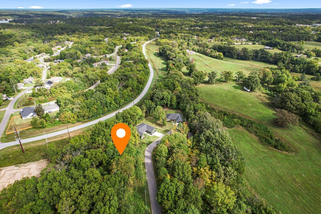 NEW Perc test for a three bedroom home on a large .4 acre lot! Ideal cul-de-sac location with gentle slope, perfect for a 4 car garage. With large road frontage there's over 130 linear ft of building space for that nice big garage or sprawling ranch you've been dreaming of! This is a great opportunity to get into an area of Bella Vista that is growing with several new construction homes built next door! 15 minutes from downtown Centerton, the next area to get the NWA downtown treatment! 2 miles to Granton Park marina and boat launch on Loch Lomond! 1.6 miles to Tunnel Vision bike trail. Perc test in supplements.