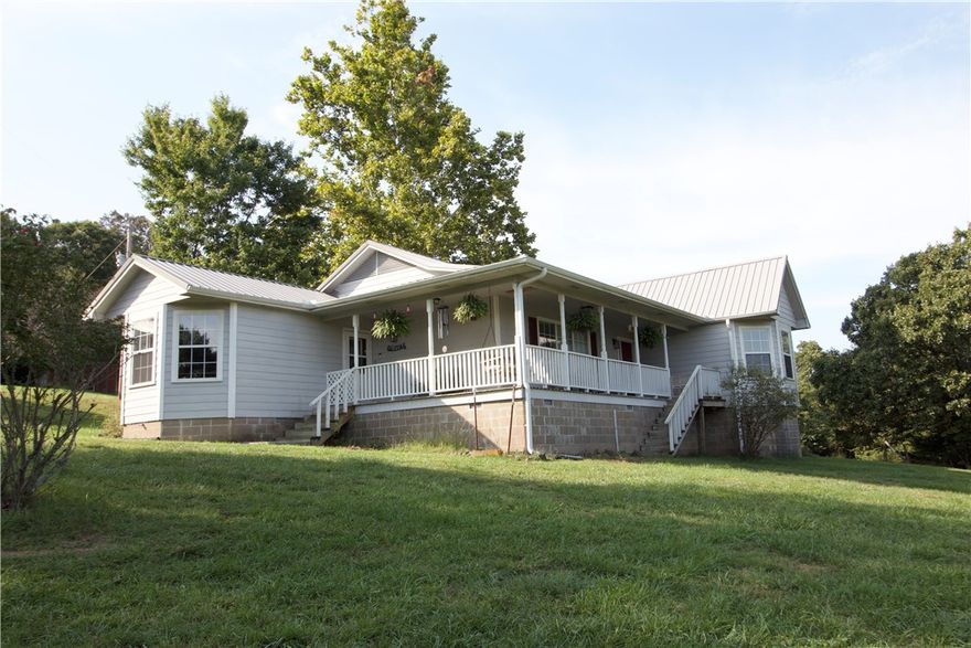 ?Escape to the country! If you’re looking for some well deserved peace and quiet but would like a little adventure too, you’ve found it here. Three bedrooms, office, eat-in kitchen with top end appliances (less than 1 yr-3 yrs old), 2 full baths, wrap around porch with swing and beautiful views and a back porch to enjoy watching the deer. Bring your ATV’s and explore the miles of dirt roads. Double garage with attached workshop (heated and cooled). Build a coop and raise some chickens, have a horse or cow, make a garden and grow your own veggies, hunt your own land. Plenty of room for a ‘she shed’ or another home on the property. Approx 15 min to Walmart, 10 min to Harps and 3 hardware stores, Granny’s Kitchen and downtown square.