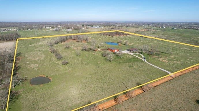 Fantastic 40 Acre developmental potential property off Vaughn Road in Bentonville. One parcel 40.09 Acre property, with two ponds, wooded and pasture areas with city water and electric on site. Prime location surrounded by new and upcoming residential developments. Easy access to Regional Airport and 102. 3 Bed/2 Bath home on property. Donāt miss out on the opportunity to own this Bentonville property, abundant options whether agricultural, developmental, or personal! Red metal building on property does NOT convey along with additional list of items, see attached. Value is in land. Home to be shown only after accepted offer.