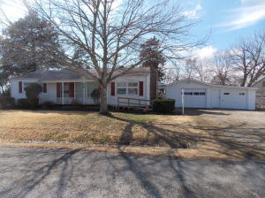 Lake community cutie with enough storage for all your toys! This great house is on 3 lots with the house being on the corner, with TONS of storage for all your lake toys and plenty of room for entertaning. The RV/Boat storage is 36 x 30 with 3- 12' bays, one of which is enclosed with a concrete floor for extra storage. The garages are 19' deep. There is also a 10 x 16 storage building with 2 lofts and an awesome porch. The roof was replaced on the house with brand new metal just last month. You won't be disappointed.