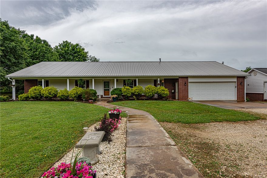 WELCOME HOME! This 4 bed 2 bath home with a bonus or media room on 3.03 acres +/ - is what you've been looking for to plant your roots or start a hobby farm! Located mins from Downtown Prairie Grove, Lincoln, I-49, & Fayetteville, this property offers a great opportunity for those seeking space while being conveniently located. From the covered porch, head in to the large living area feat wood flooring & French doors providing natural light. Flow into the eat-in kitchen & dining feat black S.S appl, light wood cabinetry, tile flooring! Relax in the primary suite feat a private ensuite w/ dual sink vanity! Enjoy an additional 3 beds and 1 bath! Head out to the detached garage featuring a 285 SQFT bonus room & addtl. storage. Head out back to the covered patio or deck with a hot tub overlooking the back lawn. This property features multiple outbuildings incl. a dairy barn, pole shed, & storm shelter offering versatile use options. BONUS this property features new HVAC 2024! Don’t miss out, act now!