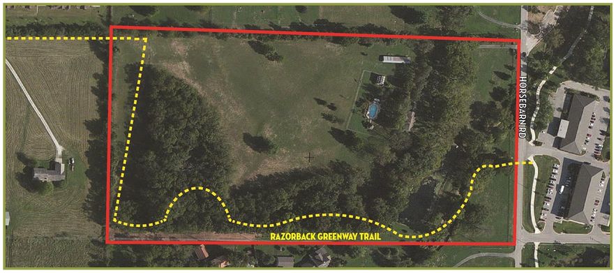 20.22 Acres for sale.  Listed at $4.42/ft.  Currently zoned PUD & R-O. property located near Walton Blvd, I-540, Toyota Auto Dealership, Upscale office development, Shops at the Forum Retail, Rogers Community Park & multi use trail system.,3,500sf 4 bedroom, 3 bath house w/pool, stables, green house and pond included with property.  Home is currently tenant occupied.