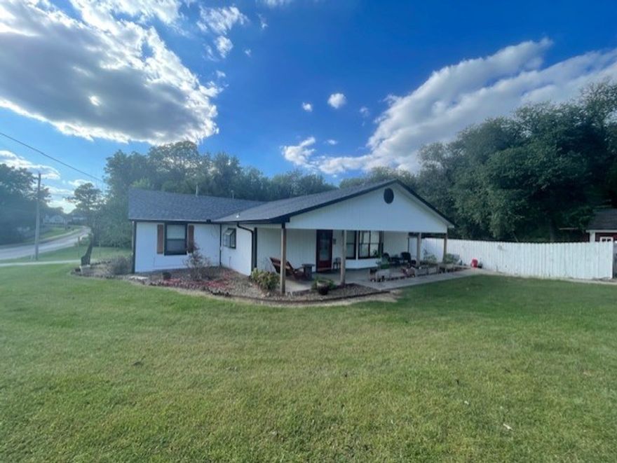 Welcome Home! This cozy country home is nestled amongst trees on .72 acres. This property is located in a great Springdale location only 10 minutes from the University and 1 1/2 miles to the Razorback Greenway. Enjoy two large bedrooms, a spacious living room with an open floor plan with an eat in kitchen, as well as on office. Enjoy the perfect mix of comfort and space in a serene location. Plenty of opportunities for fun and outdoor living. New Roof 2025, Freshly painted Main areas. Property SOLD AS IS! Tractor and mower to convey with acceptable offer.