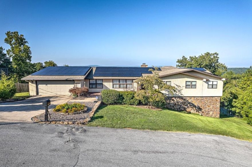 Beautiful views of Beaver Lake from this unique home on 2.5 acres. This home is a rarity with a floor plan that is perfect for entertaining & has more storage than you can imagine! Main level boasts the primary suite w/two walk in closets, shoe closet & view of the lake. On the main level is another ensuite
bedroom with a sitting area & a third bedroom near the hall bath. Formal living & dining rooms. Living room open to the kitchen & breakfast area; All with lake views. Butler's pantry; Chefs kitchen; Library. Downstairs is a full kitchen plus a living area w/fireplace. Exercise room; Sewing room; Storage area; Theater room; Office. Multiple deck spaces overlook private back yard with beautiful lake views. Pool w/deck space. Backup generator powers entire home. Solar panels (paid in full) power the home. Ask for special features sheet.