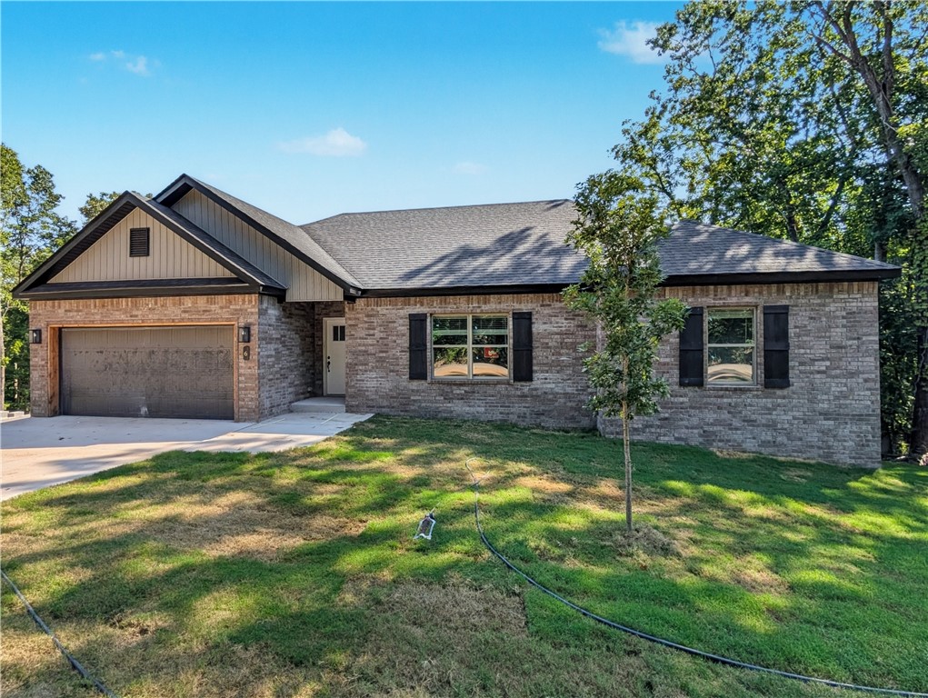 Welcome To Your Next Home! Great Location w/ Easy Access To The Village And I-49. Just Around The Corner From Park/Lake Access. Great Floorplan Offering A Spacious Open Living Area w/ Corner Fireplace, Easy Furniture Placement. 9 Ft Ceilings Throughout. Custom Cabinets w/ Granite Counters. Kitchen w/ Island Seating + Eat-in, Tile Backsplash, Pantry, UC Lighting. Primary Suite w/ Large Walk-in. Soaker Tub, Tile Shower, Dual Vanity In Primary Bath. 2 Secondary Beds w/ Full Hall Bath Also Featuring A Dual Vanity. Nice Covered Back Deck w/ Stairs Leading Down To The Yard. Yard w/ Have Sod. Just Underway So Still Time To Make Selections. ***Sample pics of previous build as example only and may contain upgrades. This homes finishout will vary.