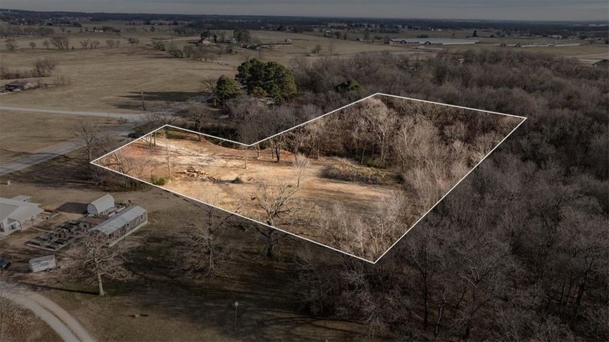 Build your dream home on this beautiful 3.78-acre tract, offering the perfect blend of open, build-ready land and wooded privacy. The property has been partially cleared and is ideal for a custom home, hobby farm, or private retreat. Enjoy peaceful country living with the convenience of being just 10 minutes from XNA Airport. Plenty of space for outbuildings and animals.