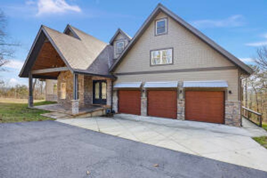 Nestled on 5 expansive acres, welcome to this stunning home offering breathtaking views of Mount Nebo and Illinois Bayou. With   5bedrooms and 5 bathrooms, is the epitome of comfort and sophistication. Step inside to find spacious living areas with modern finishes and thoughtful design. Four of the bedrooms feature heated floors, ensuring warmth and coziness year-round. The home boasts a large, open-concept kitchen and living area, perfect for entertaining. For those who love the outdoors, the 1,100 sqft outdoor kitchen is a dream, complete with top-of-the-line appliances, multiple-level laundry rooms for convenience and efficiency, catering to the needs of the entire family, and plenty of space for gatherings.