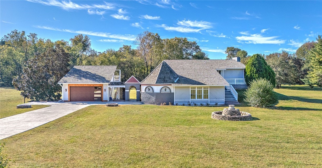 Amazingly rare find in one of the most sought-after residential areas of Northwest Arkansas.  This 3370 square feet Custom Built Home sits on 2.5 +/- acres.  This home is located at the border of Springdale and Fayetteville, close to Botanical Gardens and Lake Fayetteville.  Clear Creek creek runs in the back part of the property. The property includes a an inground 40*20 square foot diving pool (8 ft deep end), enclosed by infinity aluminum fencing. It further includes a 2 story, 800 sq foot pool house!!
Home has an oversized garage with a beautifully covered breezeway giving it a peaceful vacation feel. This all-electric home boasts cathedral ceilings upstairs with cedar and oak throughout.  The wood burning fireplace is ducted to provide for further/ natural heat.  Pella window and doors are installed throughout the home. Each of the 4 bedrooms are accompanied by their own full-size bathroom.  Homes like this do not come available often in this area.  Come make this dream of a home your Dream Home!!