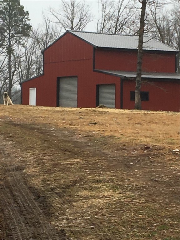 A rare opportunity to own over 30 acres of beautiful Ozark property, just under 6 miles from downtown Eureka Springs!
Approx 10 open acres currently host animals and a productive pear orchard generating substantial annual income. The property includes a 1,200 sq. ft. shop with loft, electricity, and cold storageāperfect to use as-is or convert into a barndominium. Also featured: an 832 sq. ft. barn and a 1,248 sq. ft. carport for your farm equipment/toys.
With power on-site (just add well and septic), this is a prime canvas for your hobby farm/homestead. Enjoy natural beauty, wildlife sightings, and the convenience of being close to town while having room to expand and grow.