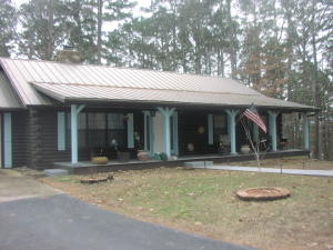 Beautiful log home, nestled on the mountain overlooking the quaint town of Jasper, AR, and the Little Buffalo River. Home at the end of the road for secluded privacy. 14.81 acres. 3 Bed, 2 bath, with a 2 car attached garage, a 3 car detached garage and a 20'X40' RV/Shop. Central air and heat. Propane. Hardwood floors, fireplace, granite countertops, extended deck make this a spectacular home!