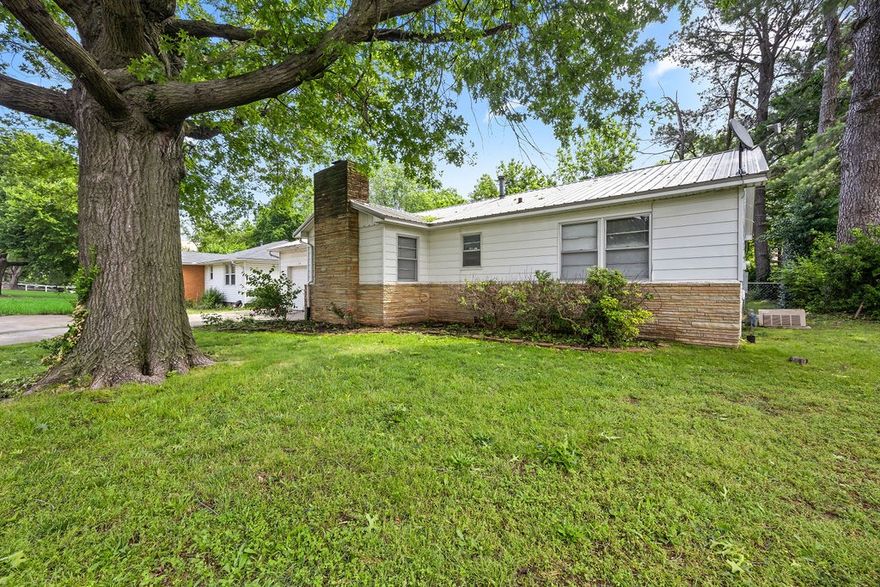 Welcome to your dream home, nestled in a vibrant neighborhood with unmatched convenience! This charming residence is an ideal blend of comfort, style, and accessibility, perfect for families and professionals alike. Just a stone's throw from essential services, it’s within walking distance of a major hospital, providing peace of mind in emergencies. Top-rated schools are nearby, ensuring school runs are a breeze. For book lovers and lifelong learners, the local library is just a 3-minute drive or a 10-minute walk away. Enjoy culture and education just around the corner. Downtown is just minutes away with dining, shopping, and entertainment. Gather around the wood-burning fireplace on the holidays. Relax or entertain on the large, covered patio perfect for summer barbecues. This home features 3 bedrooms, 1 updated bathroom and a new half bathroom. The attached garage is also heated and cooled with an insulated garage door and has a large standing height storage space in the attic for all the extras. Come see today!
