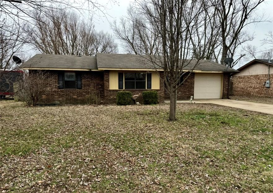 Located right next to the brand-new Walmart headquarters, this 3-bedroom, 1-bathroom home offers incredible potential! With 1,196 sq ft of living space, this property presents a fantastic opportunity for those looking to make it their own or investors seeking a prime location for future growth. The home is being sold as-is, providing you with the perfect canvas to personalize and renovate to your liking. Inside, you’ll find spacious rooms with ample natural light, ready for your vision. The kitchen, living room, and bedrooms are all generously sized, offering a comfortable foundation to create the perfect home. The large backyard offers plenty of space for outdoor activities, gardening, or even future expansions. The home's location is unbeatable, with easy access to major highways, shopping, dining, and, of course, the new Walmart headquarters, ensuring long-term value and convenience. This home is perfect for buyers ready to bring their creative ideas to life or anyone looking to capitalize on a booming area.