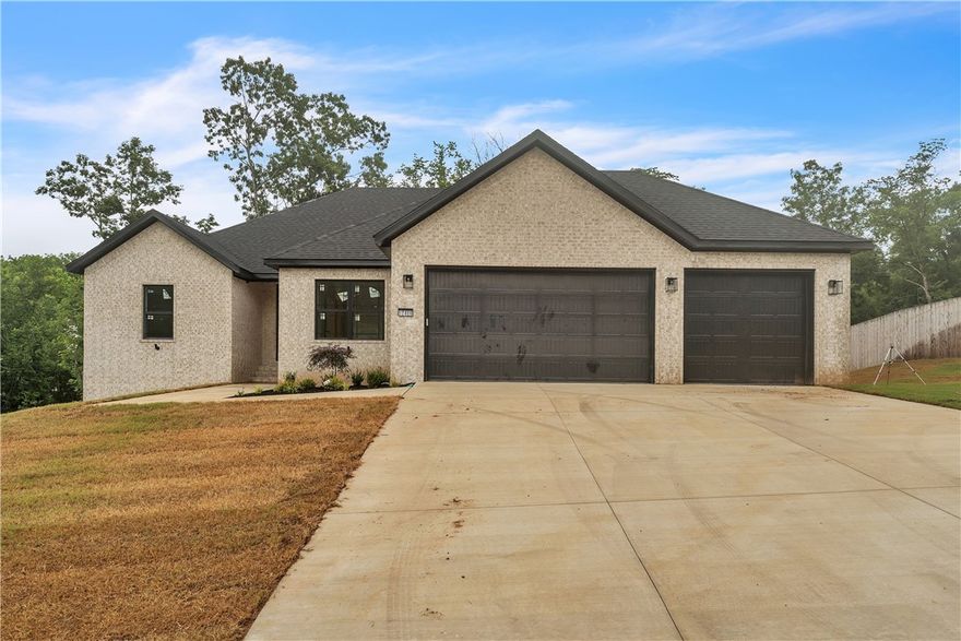 Looking for a blend of convenience and luxury? This home lies on a spacious 1.04-acre lot with an excellent floorplan of 4 beds, 3 full baths, a large bonus room, & a dedicated office, sitting on two stories with a walkout basement that boasts a covered deck & covered patio. The primary suite has a great layout, with the bed, bath, and large walk-in closet connected to the laundry room. The primary bath features a rainwater showerhead w/6 body sprayers & a wand. The Windows in the dining & kitchen view the spacious backyard, letting in lots of light. The 3-car garage has insulated walls & doors for comfort in the summer & winter. The tall ceilings throughout invite you to stay. Lastly, fiber optic high-speed internet is on-site, only 23 minutes from the home office and 21 minutes from Rogers shopping. Rates as low as 4.75% (depending on credit) or $20K Seller credit & up to $5K preferred lender credit w/acceptable offer.