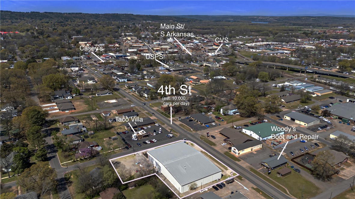 This building has 8'' foam insulation in ceilings, nearly 20,000 sf heated and cooled per owner!Located on busy 4th street (8800 cars per day per AR DOT 2022) This could be a huge storage facility, or contain a large showroom, offices or any other business suited for C2 zoning. Furnishings and equipment also for sale separately.Parking available on property and two half city lots behind building. Loading dock and 3 overhead doors make easy loading and unloading.